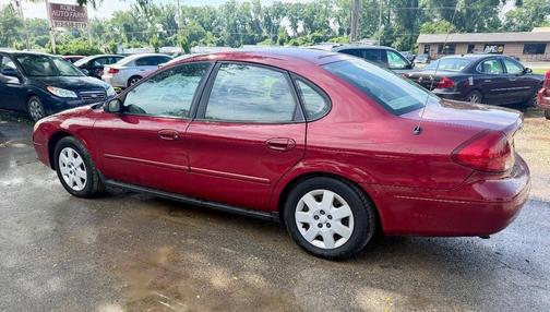 Red 2002 Ford Taurus LX 4dr Sedan
