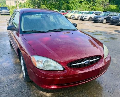 Red 2002 Ford Taurus LX 4dr Sedan