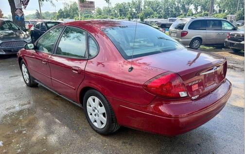 Red 2002 Ford Taurus LX 4dr Sedan