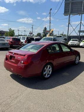 Red 2004 Nissan Maxima SE