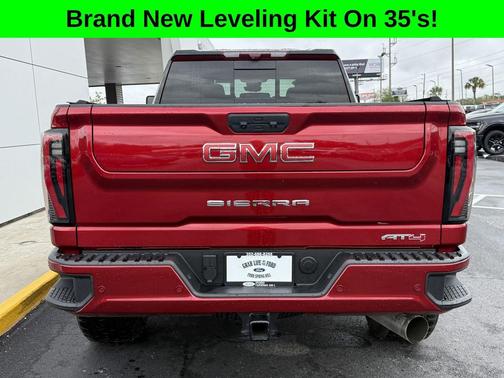 Volcanic Red Tintcoat 2025 GMC Sierra 2500 AT4