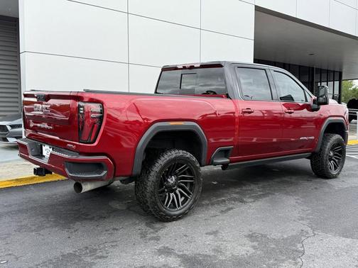 Volcanic Red Tintcoat 2025 GMC Sierra 2500 AT4