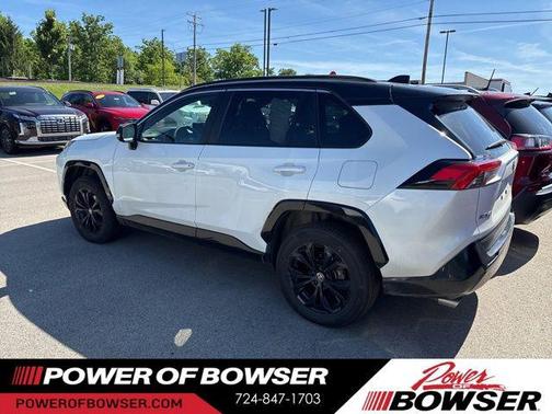 Wind Chill Pearl/Midnight Black Metallic 2024 Toyota RAV4 Hybrid SE