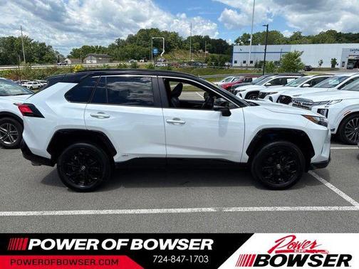 Wind Chill Pearl/Midnight Black Metallic 2024 Toyota RAV4 Hybrid SE