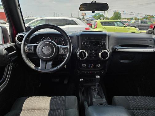 Red 2011 Jeep Wrangler Unlimited Sahara