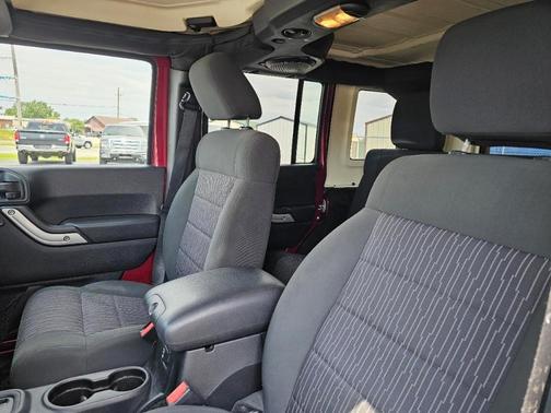 Red 2011 Jeep Wrangler Unlimited Sahara