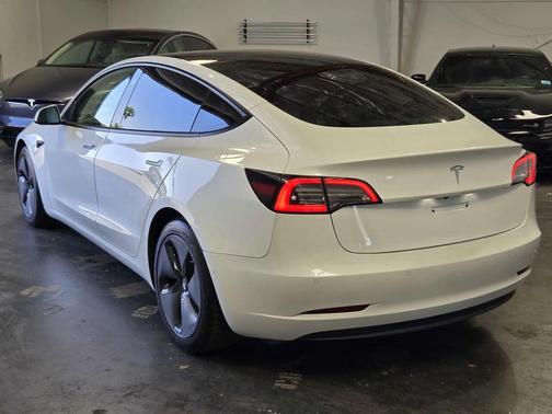 white 2021 Tesla Model 3 Standard Range Plus