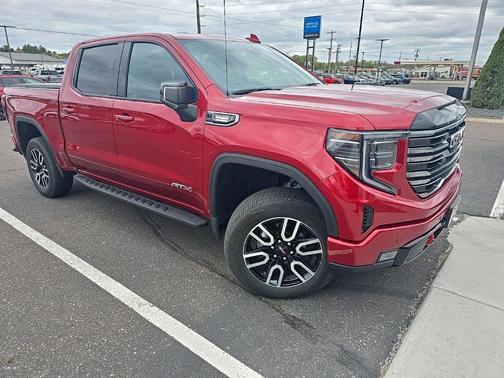 Volcanic Red Tintcoat 2025 GMC Sierra 1500 AT4