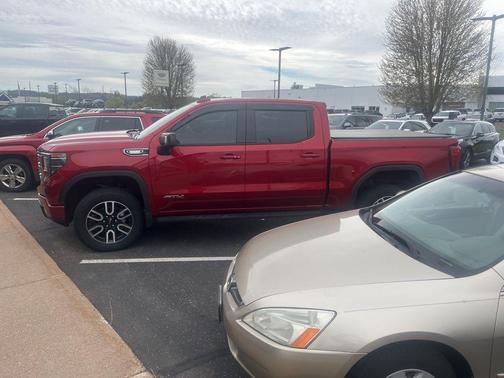Volcanic Red Tintcoat 2025 GMC Sierra 1500 AT4