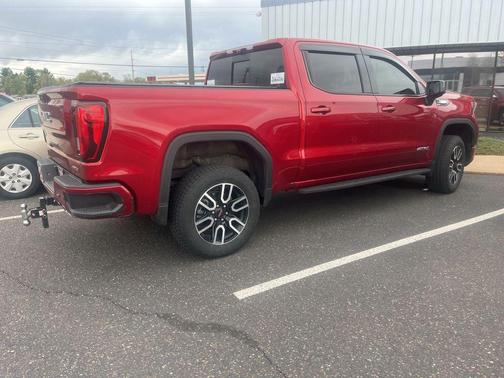 Volcanic Red Tintcoat 2025 GMC Sierra 1500 AT4