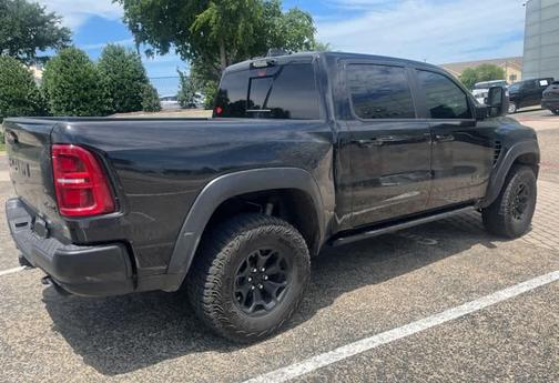 Diamond Black Crystal Pearlcoat 2025 RAM 1500 RHO Crew Cab 4x4 5'7' Box