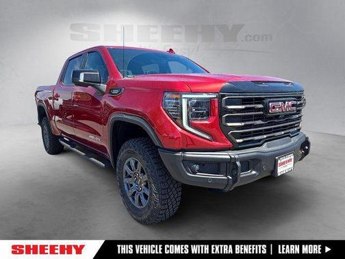 Volcanic Red Tintcoat 2026 GMC Sierra 1500 AT4X