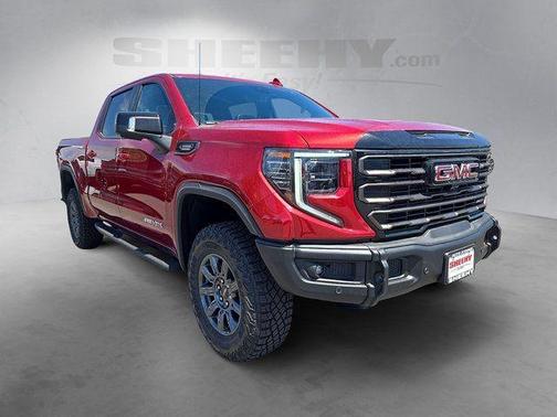 Volcanic Red Tintcoat 2026 GMC Sierra 1500 AT4X