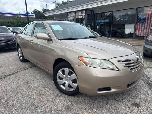Gold 2009 Toyota Camry LE