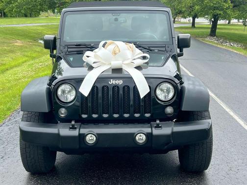 Black 2014 Jeep Wrangler Unlimited Sport