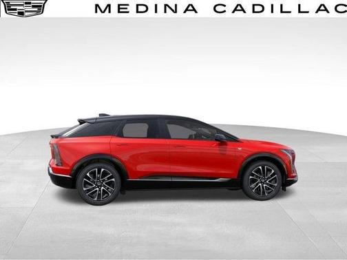 Orange 2026 Cadillac OPTIQ Premium Sport