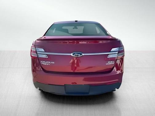 Red 2014 Ford Taurus SEL