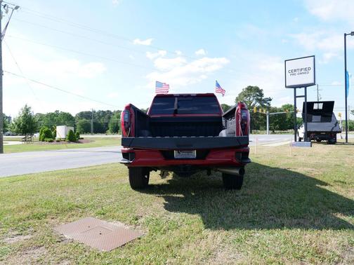 Volcanic Red Tintcoat 2024 GMC Sierra 2500 AT4