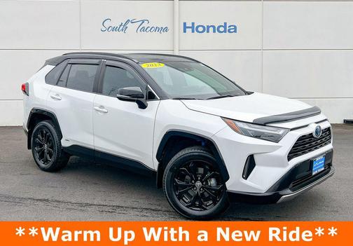Wind Chill Pearl/Midnight Black Metallic 2023 Toyota RAV4 Hybrid SE