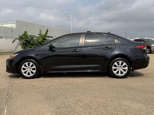 Midnight Black Metallic 2025 Toyota Corolla Hybrid LE