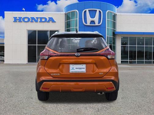 Monarch Orange / Super Black 2024 Nissan Kicks SV