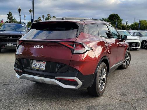 Dawning Red 2023 Kia Sportage SX