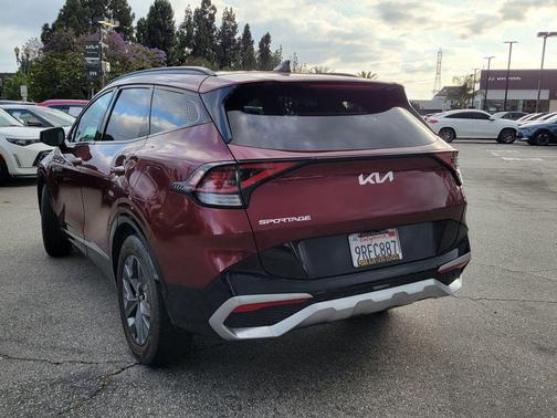 Dawning Red 2023 Kia Sportage SX