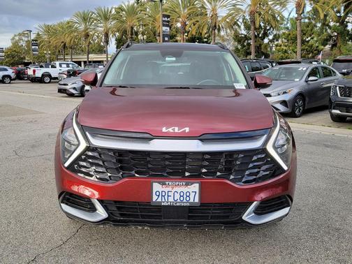 Dawning Red 2023 Kia Sportage SX