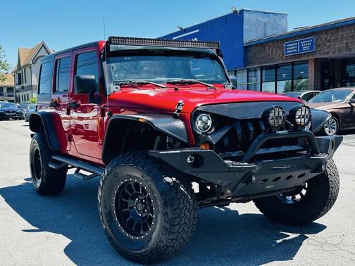 Red 2011 Jeep Wrangler Unlimited Sport