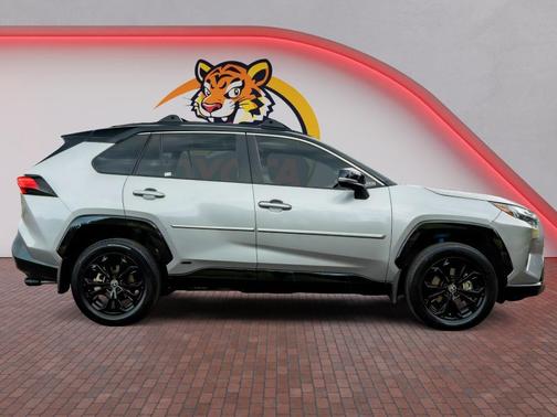 Silver Sky Metallic/Midnight Black Metallic 2024 Toyota RAV4 Hybrid SE