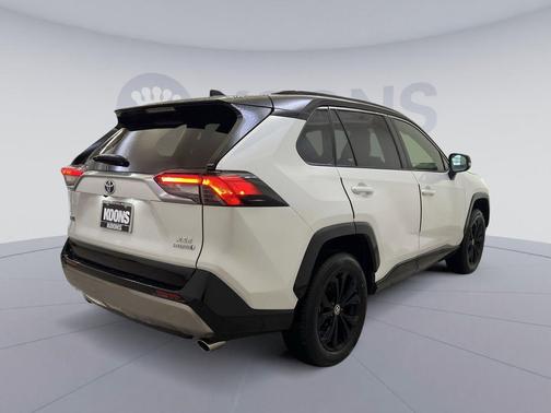 Wind Chill Pearl/Midnight Black Metallic 2023 Toyota RAV4 Hybrid SE