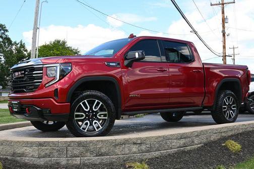 Volcanic Red Tintcoat 2024 GMC Sierra 1500 AT4
