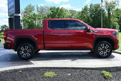 Volcanic Red Tintcoat 2024 GMC Sierra 1500 AT4