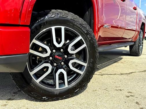 Volcanic Red Tintcoat 2024 GMC Sierra 1500 AT4