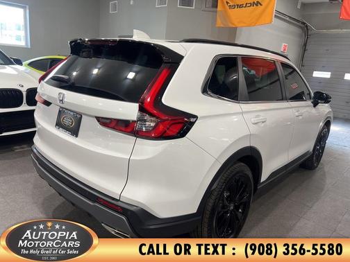 Platinum White Pearl 2025 Honda CR-V Hybrid Sport Touring AWD