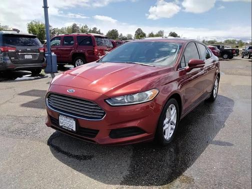 Orange 2014 Ford Fusion SE