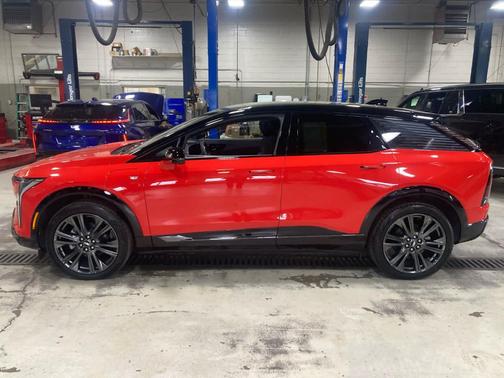 Orange 2025 Cadillac OPTIQ Sport