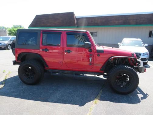 Red 2011 Jeep Wrangler Unlimited Rubicon
