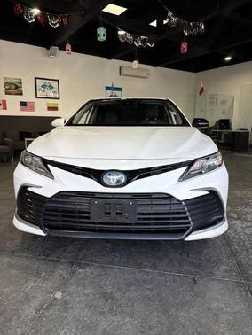 Super White 2021 Toyota Camry Hybrid LE