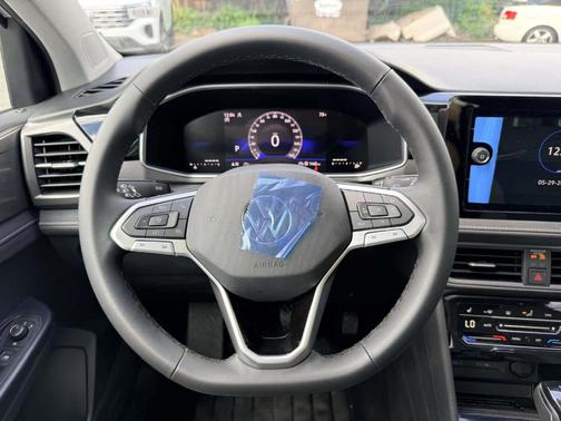 Pure White 2026 Volkswagen Taos 1.5T SE Black