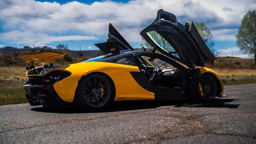 Yellow 2013 McLaren P1 Coupe
