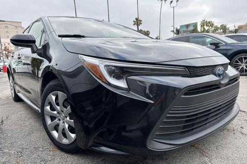 Midnight Black Metallic 2025 Toyota Corolla Hybrid LE