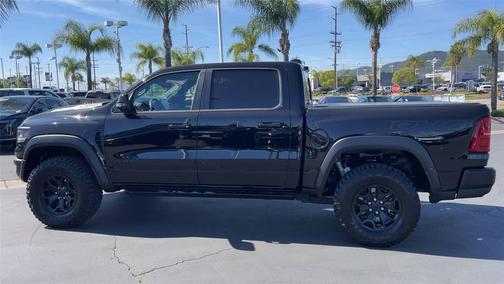 Diamond Black Crystal Pearlcoat 2026 RAM 1500 RHO Crew Cab 4x4 5'7' Box