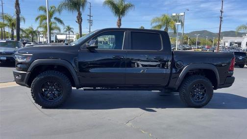 Diamond Black Crystal Pearlcoat 2026 RAM 1500 RHO Crew Cab 4x4 5'7' Box