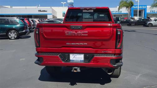 Volcanic Red Tintcoat 2024 GMC Sierra 2500 AT4