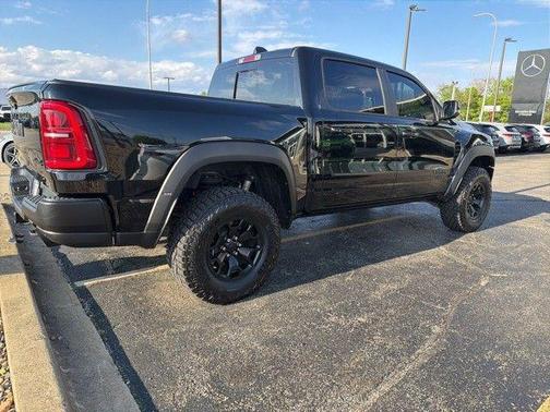 Diamond Black Crystal Pearlcoat 2026 RAM 1500 RHO Crew Cab 4x4 5'7' Box