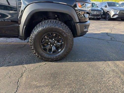 Diamond Black Crystal Pearlcoat 2026 RAM 1500 RHO Crew Cab 4x4 5'7' Box