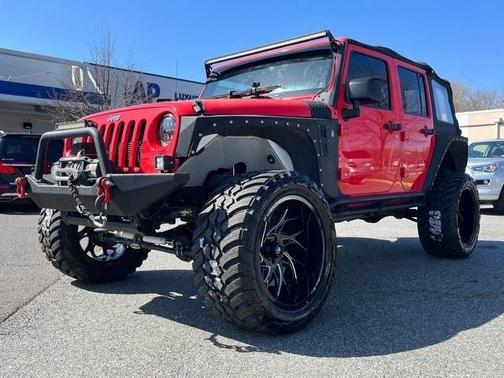 Photo 2 of 34 of 2013 Jeep Wrangler Unlimited Sport