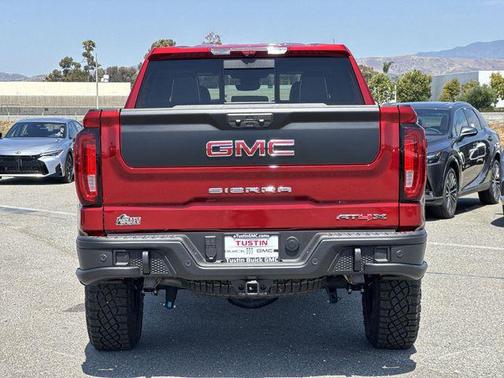Volcanic Red Tintcoat 2026 GMC Sierra 1500 AT4X
