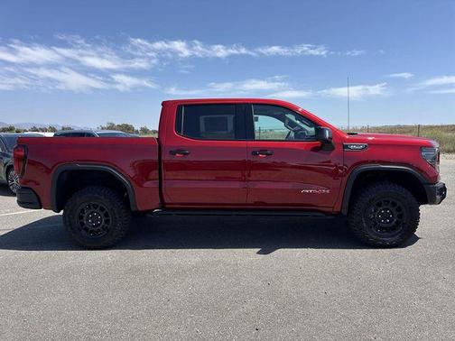 Volcanic Red Tintcoat 2026 GMC Sierra 1500 AT4X